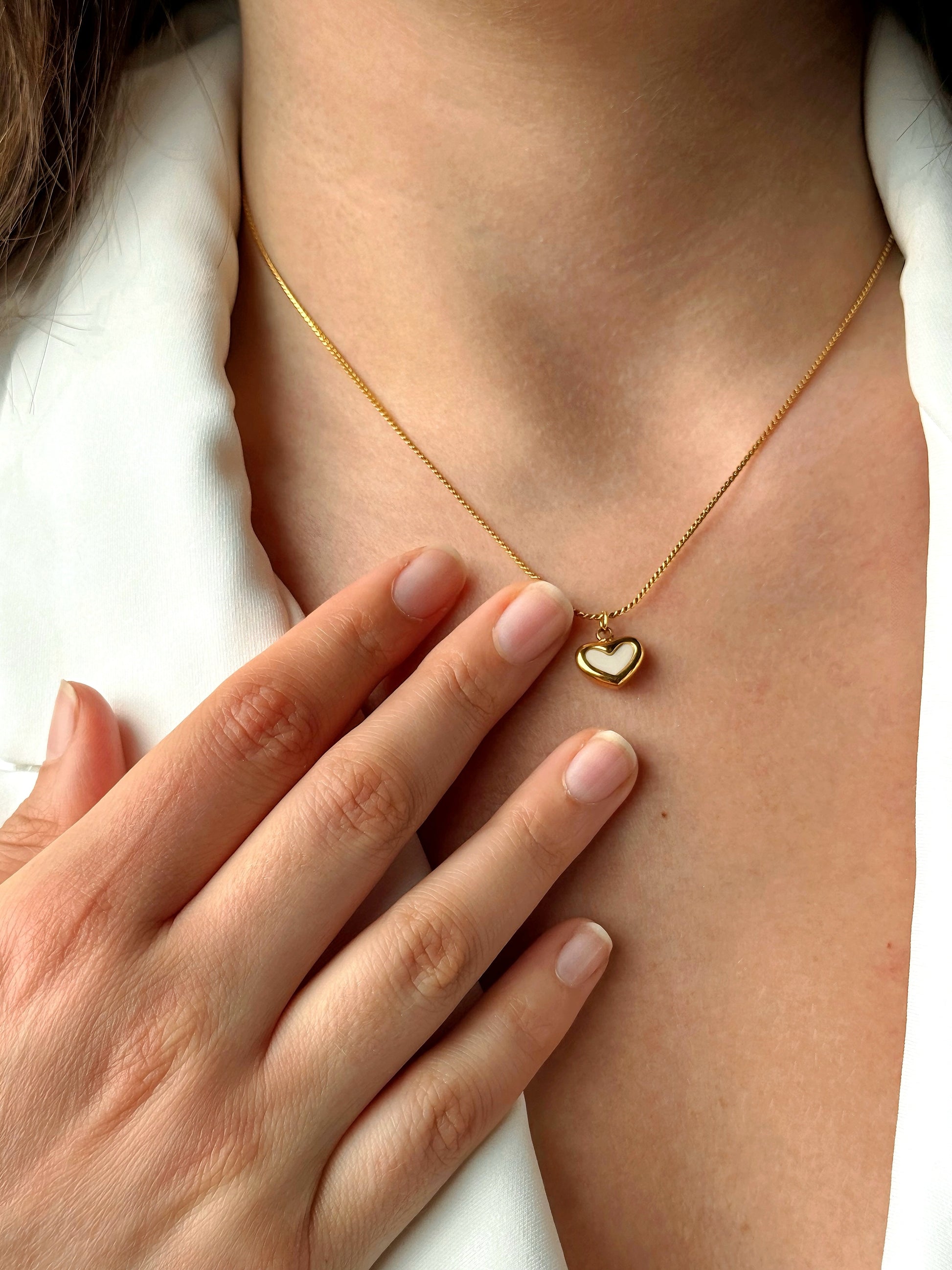 Echok Jewelry's gold heart locket necklace, featuring a beautifully crafted heart-shaped locket in 18k gold, perfect for storing cherished photos or mementos. This elegant necklace symbolizes love and memory, ideal for special occasions such as anniversaries, birthdays, or as a thoughtful gift.